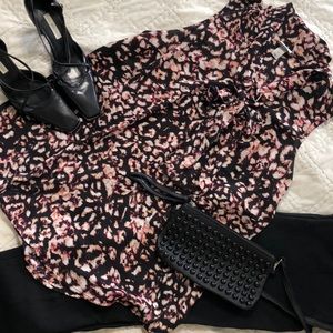 Dressy sleeveless bow front top